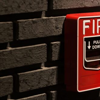 A-fire-alarm-call-point-box-on-a-brick-wall-178722659_1257x835-SM-TWT